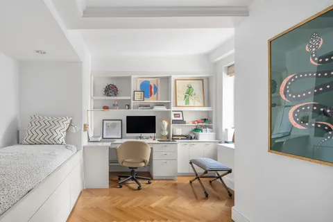 a workspace with furniture and a window