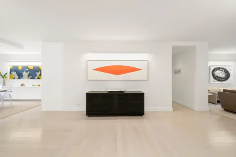 a view of a livingroom with furniture and a fireplace