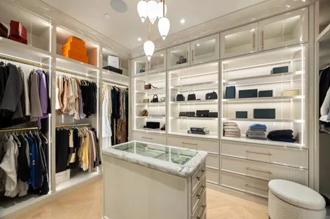 a bedroom with a large bed and a large window