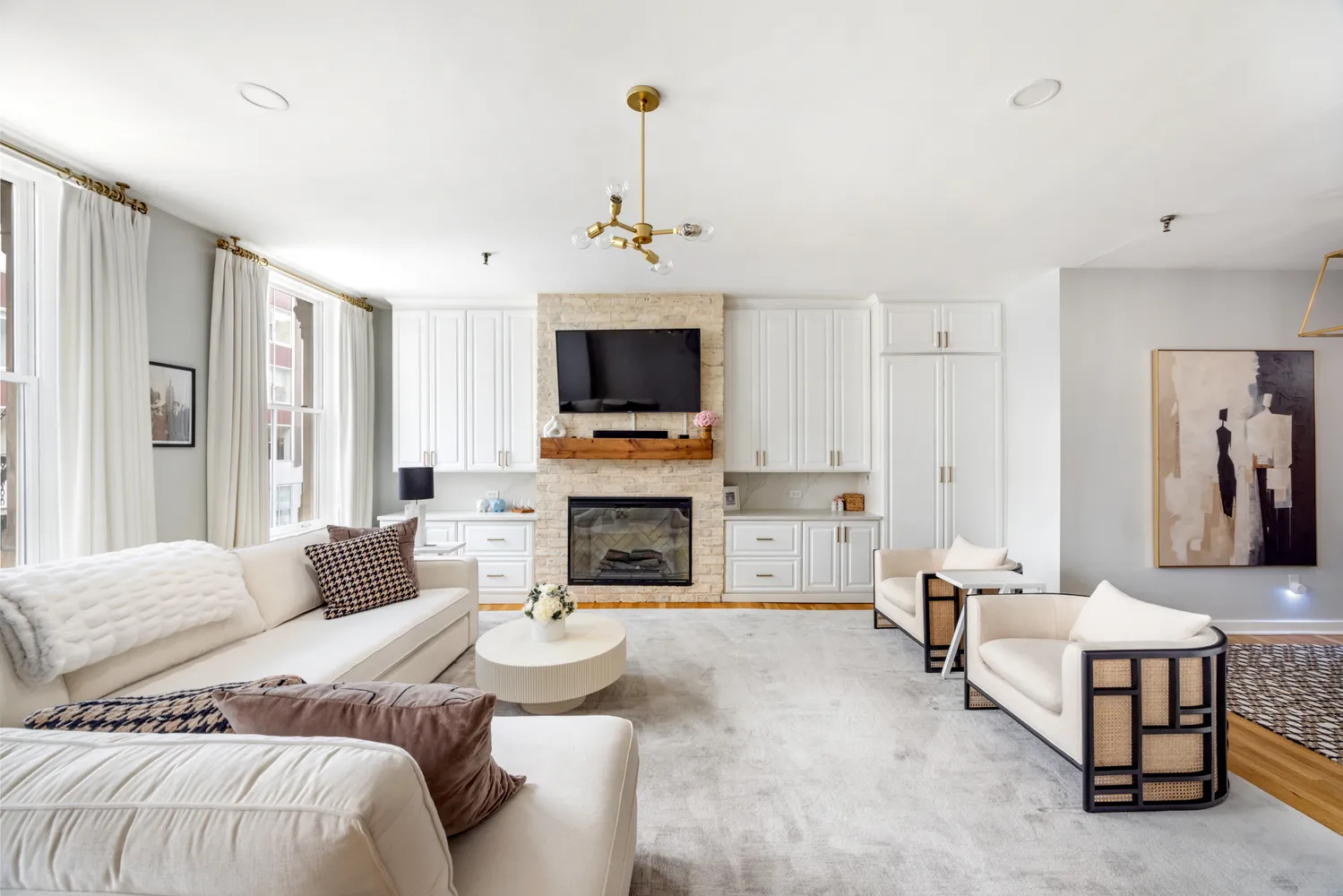 a spacious bedroom with a bed and a fireplace