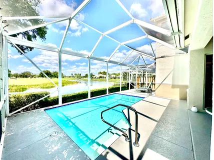 a view of swimming pool with seating area