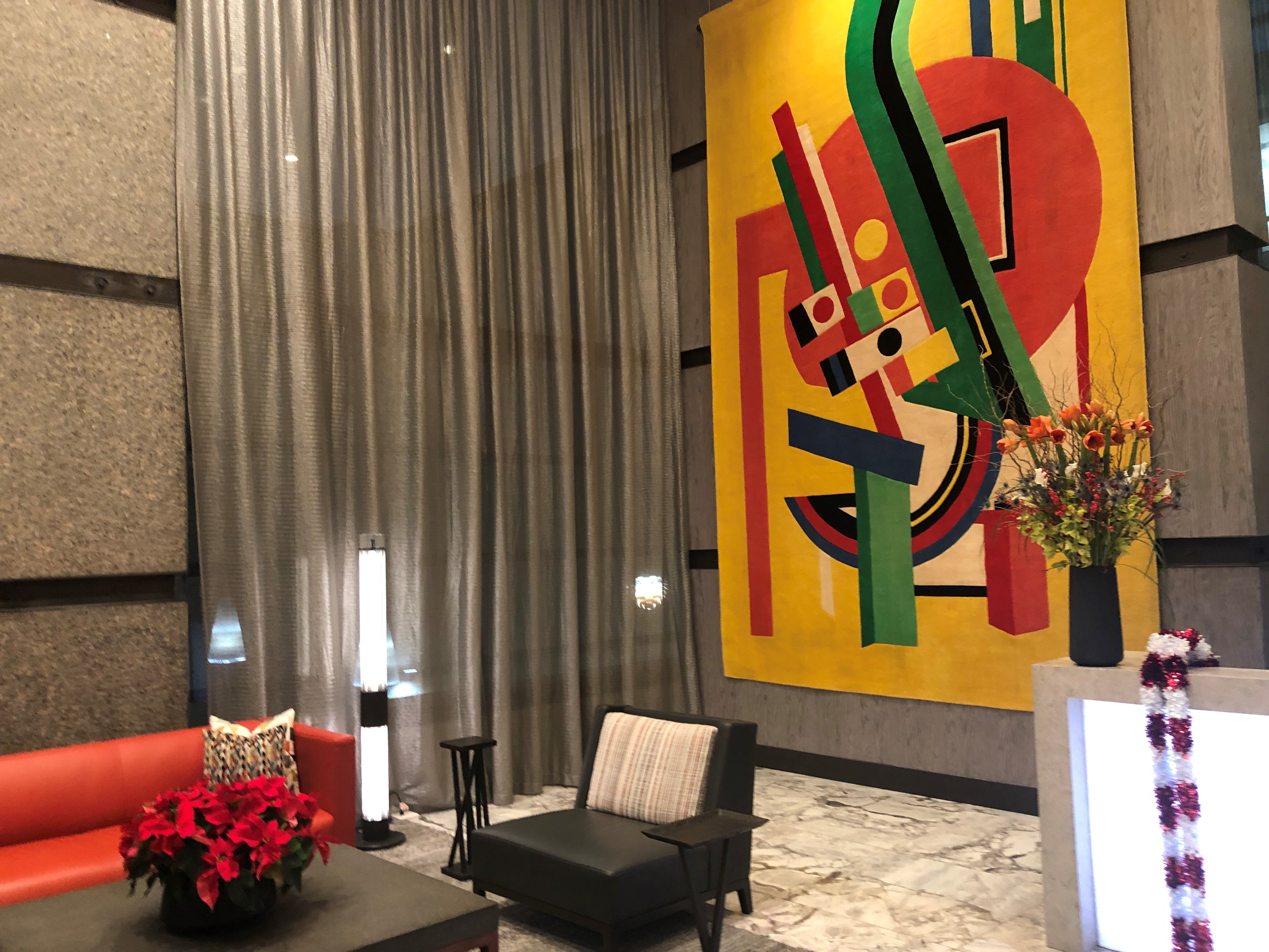 117 East 57th Street, Unit 21H Manhattan, NY 10022 - Photo 17 of 26 a bedroom with furniture and a window