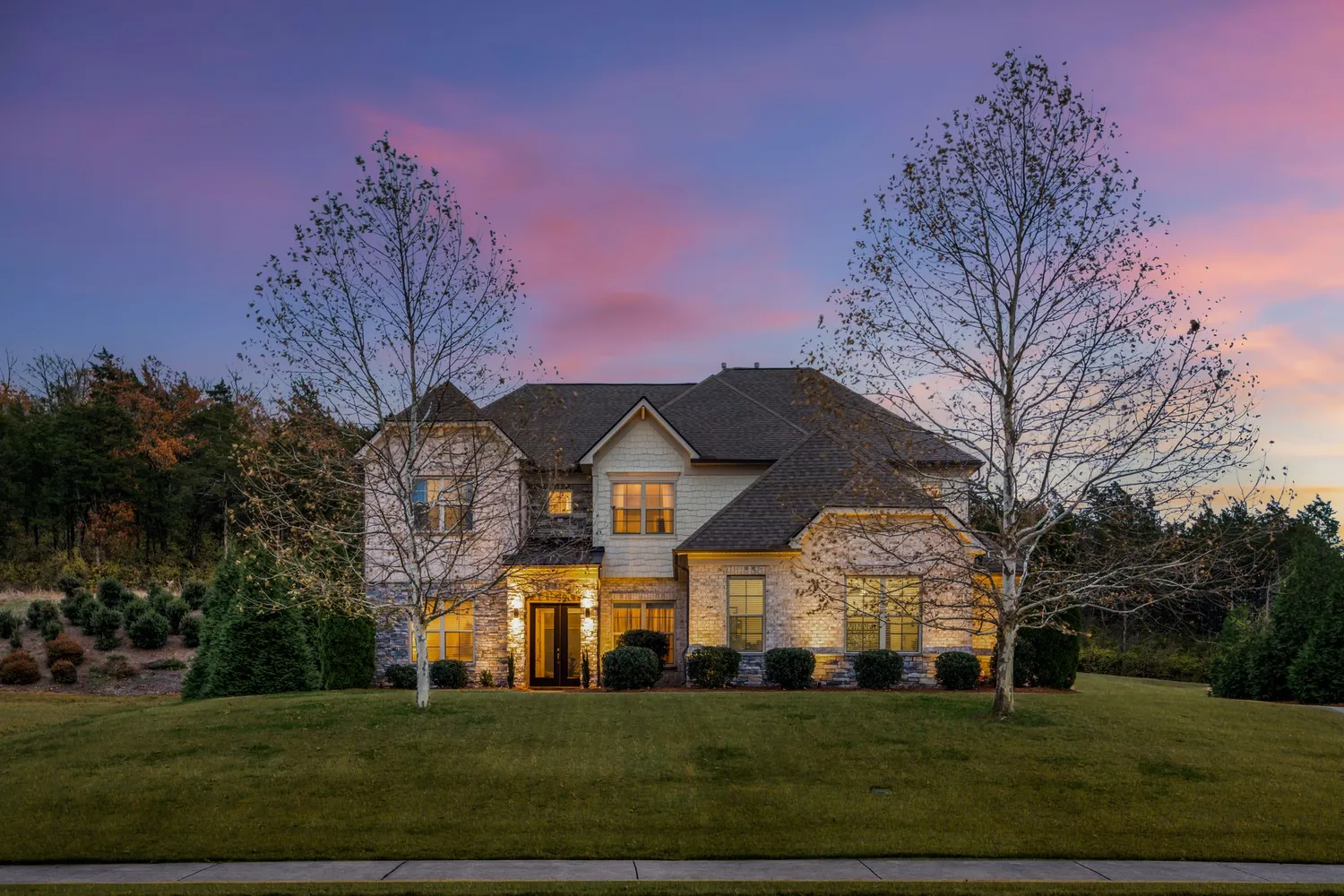 a view of a large building with large trees