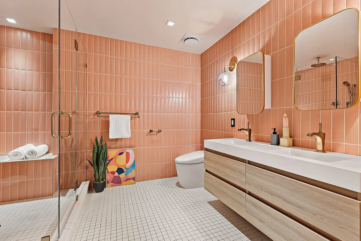 115 Allen Street, Unit 3 Manhattan, NY 10002 - Photo 7 of 13 a bathroom with a sink a toilet and shower