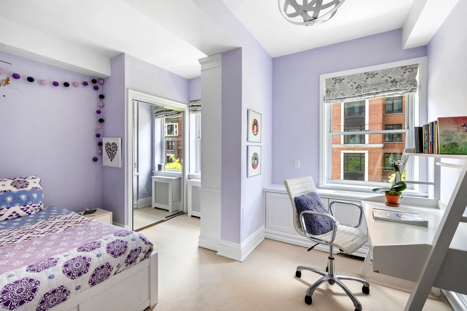 a bedroom with a bed and a desk