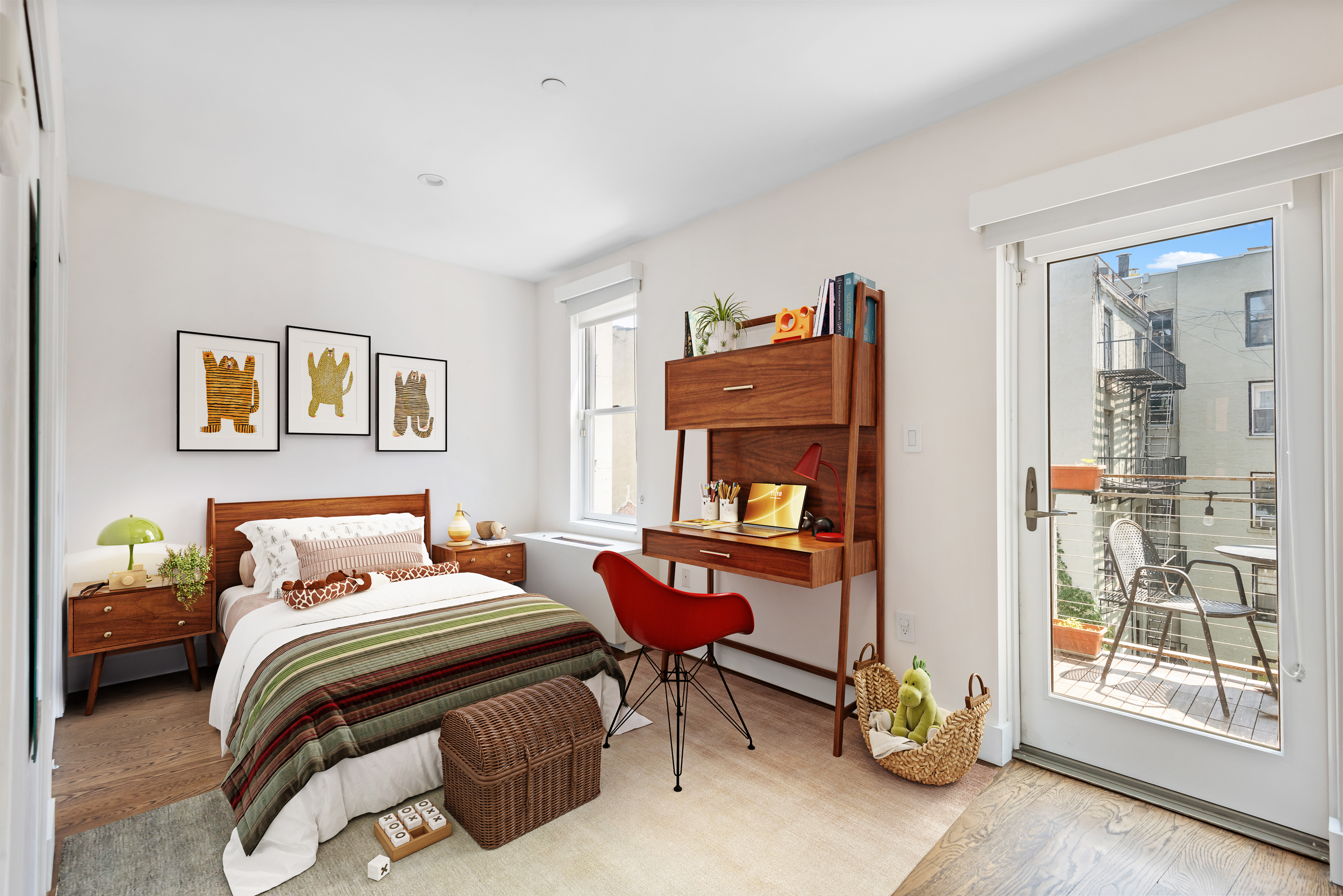 176 Mulberry Street, Unit 5 Manhattan, NY 10013 - Photo 10 of 12 a bedroom with a bed and wooden floor