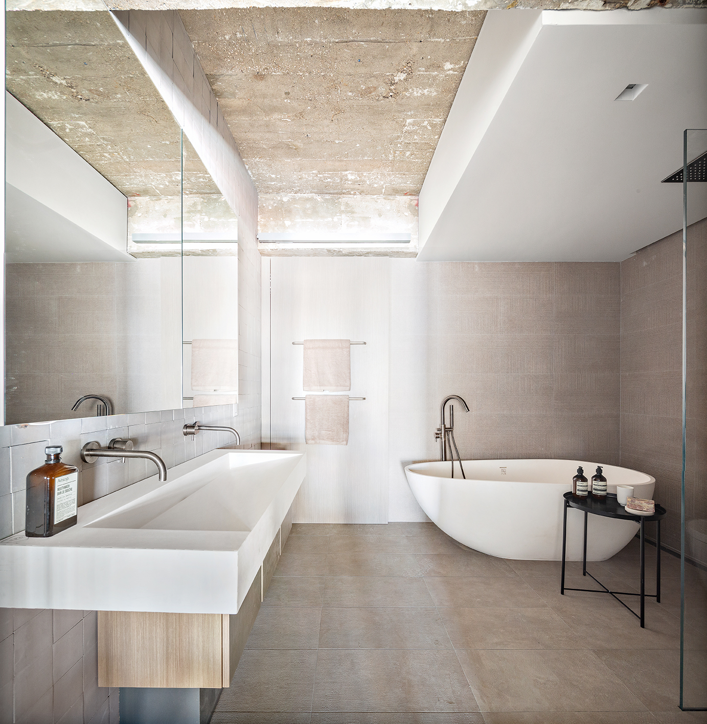 330 Wythe Avenue, Unit 6I Brooklyn, NY 11249 - Photo 9 of 14 a bathroom with a bathtub a sink and a window