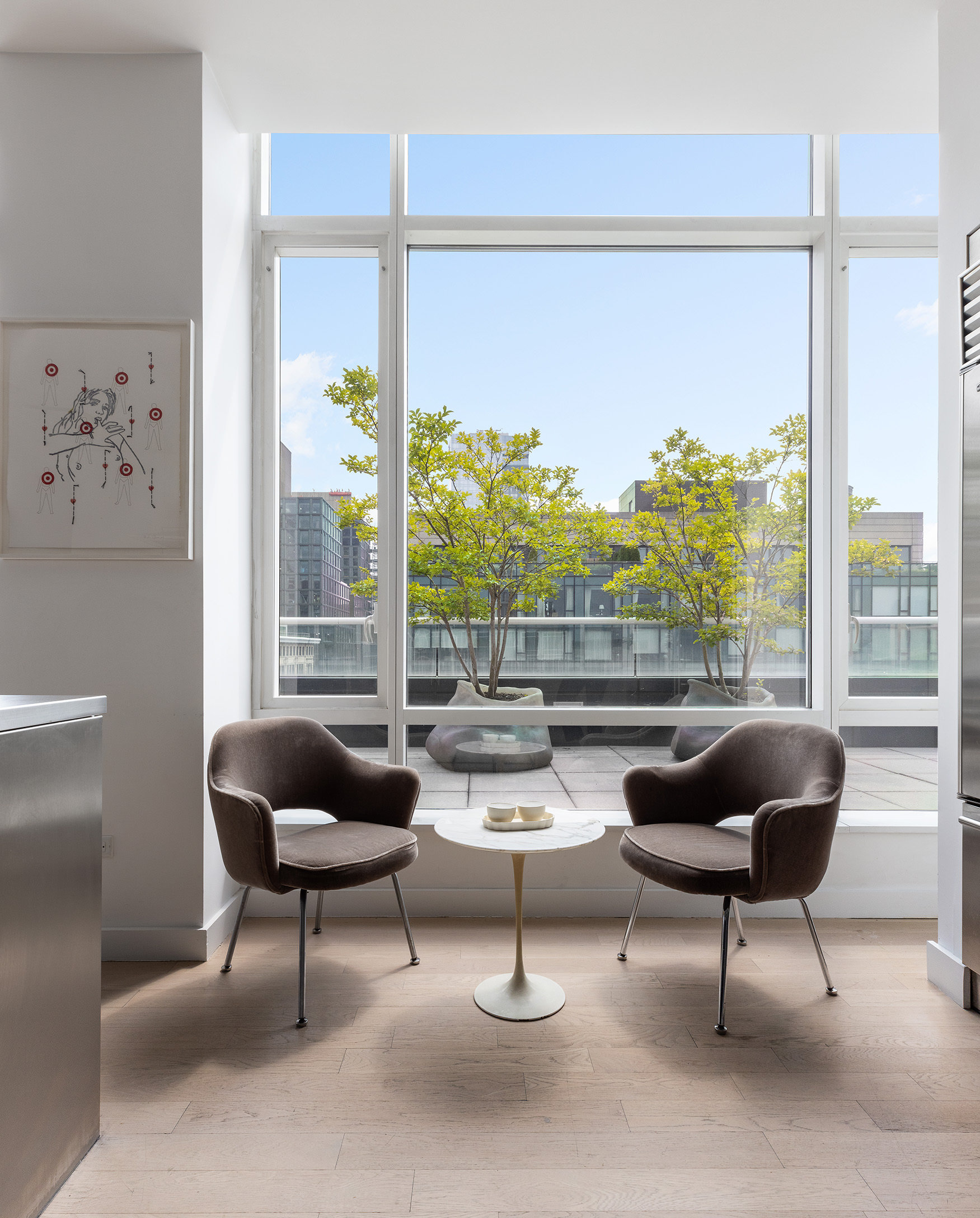 330 Spring Street, Unit PH Manhattan, NY 10013 - Photo 11 of 23 a living room with furniture and a large window
