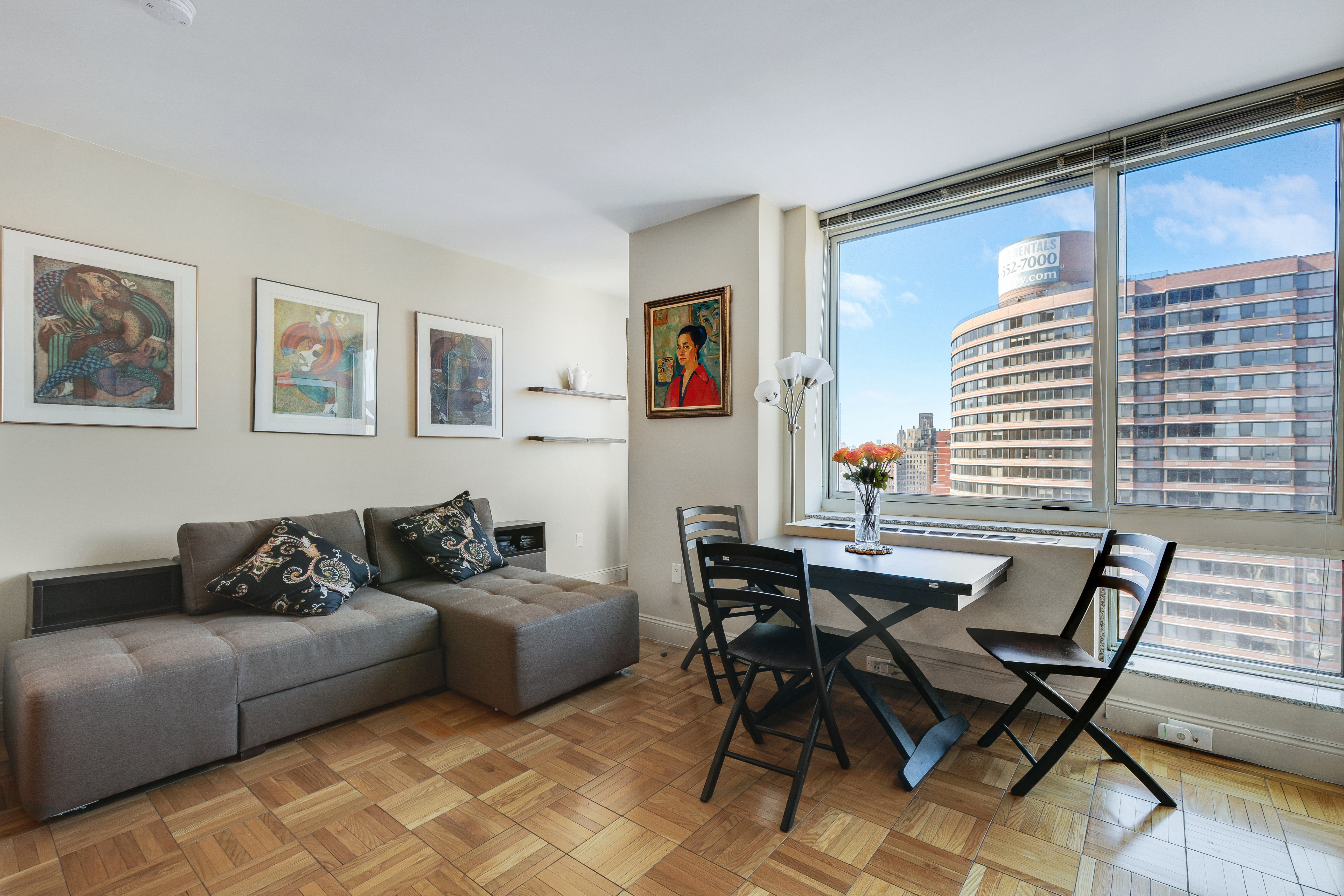215-217 East 96th Street, Unit 25K Manhattan, NY 10128 - Photo 2 of 16 a living room with furniture and a window