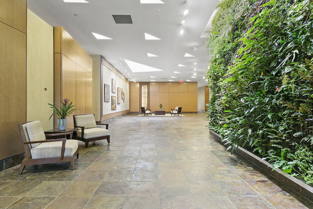 40 West 116th Street, Unit A313 Manhattan, NY 10026 - Photo 9 of 21 a lobby with furniture and a potted plant