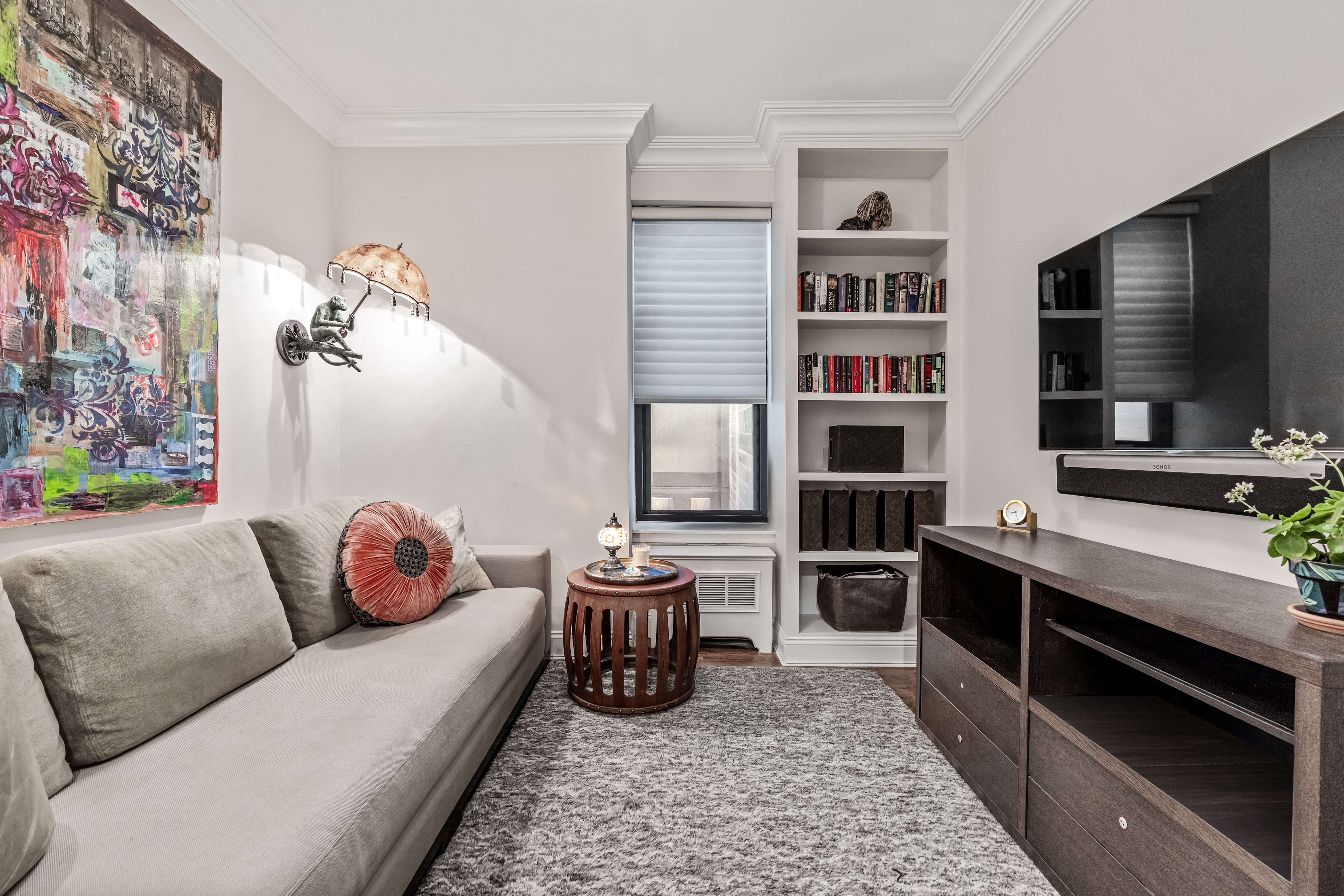 101 West 81st Street, Unit 601 Manhattan, NY 10024 - Photo 7 of 12 a living room with furniture fireplace and flat screen tv