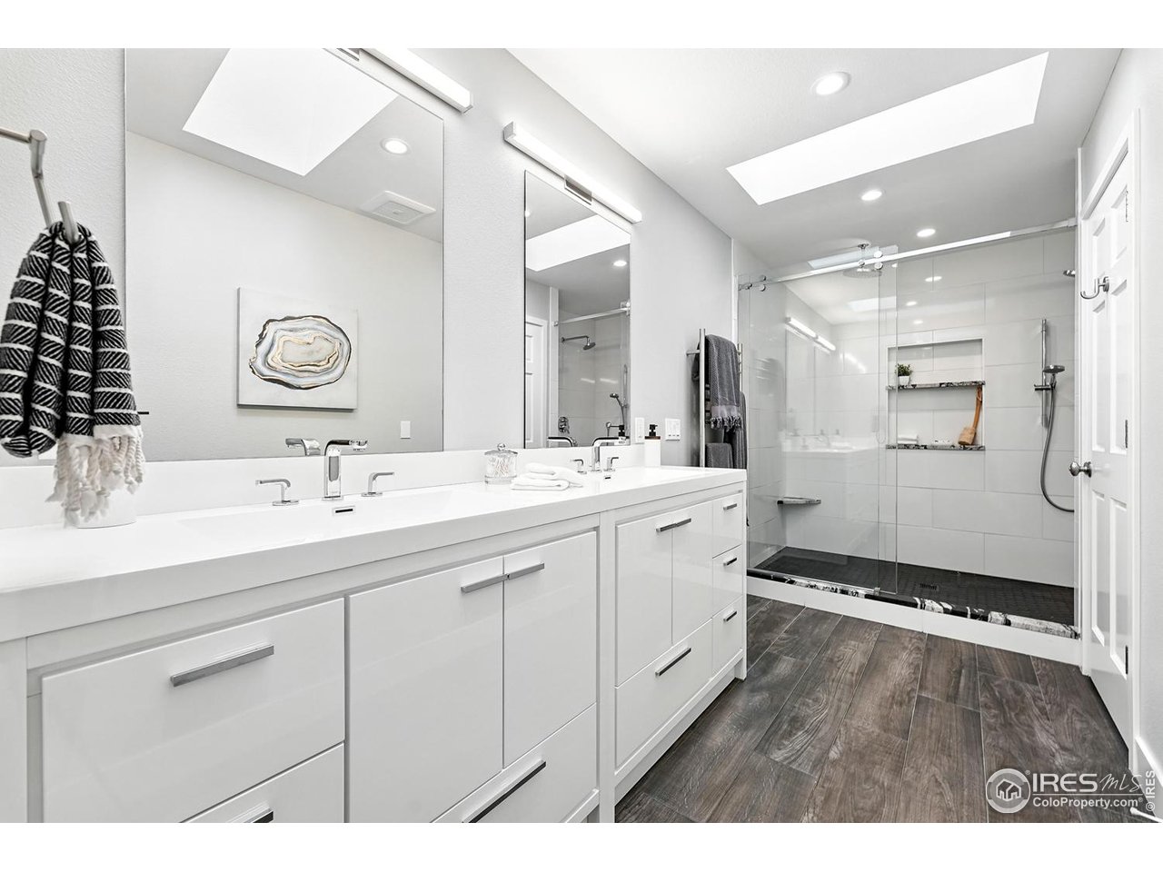4557 Apple Way Boulder, CO 80301 - Photo 7 of 50 a bathroom with a double vanity sink mirror and