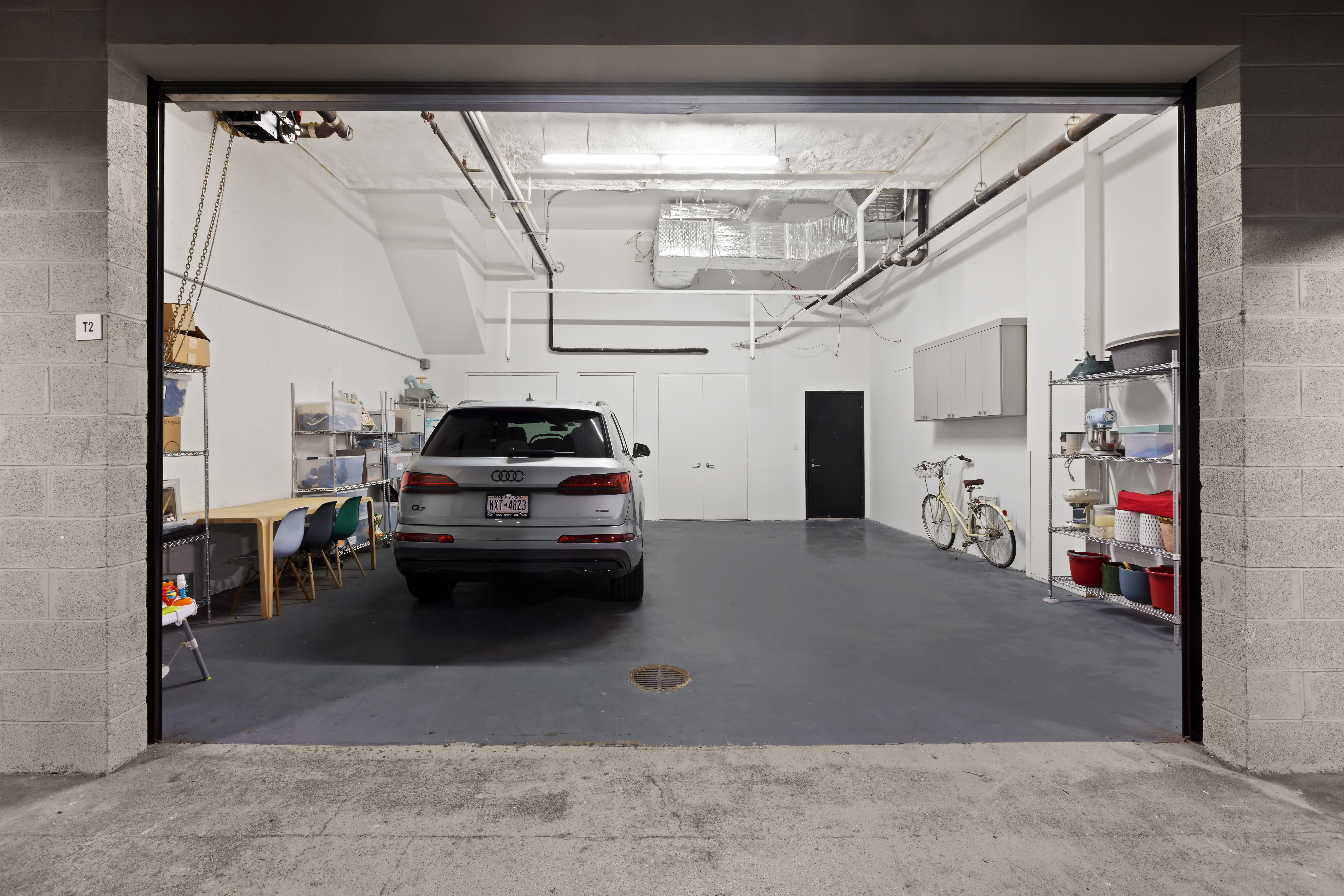 429 Kent Avenue, Unit TH2 Brooklyn, NY 11249 - Photo 26 of 34 a car parked in garage