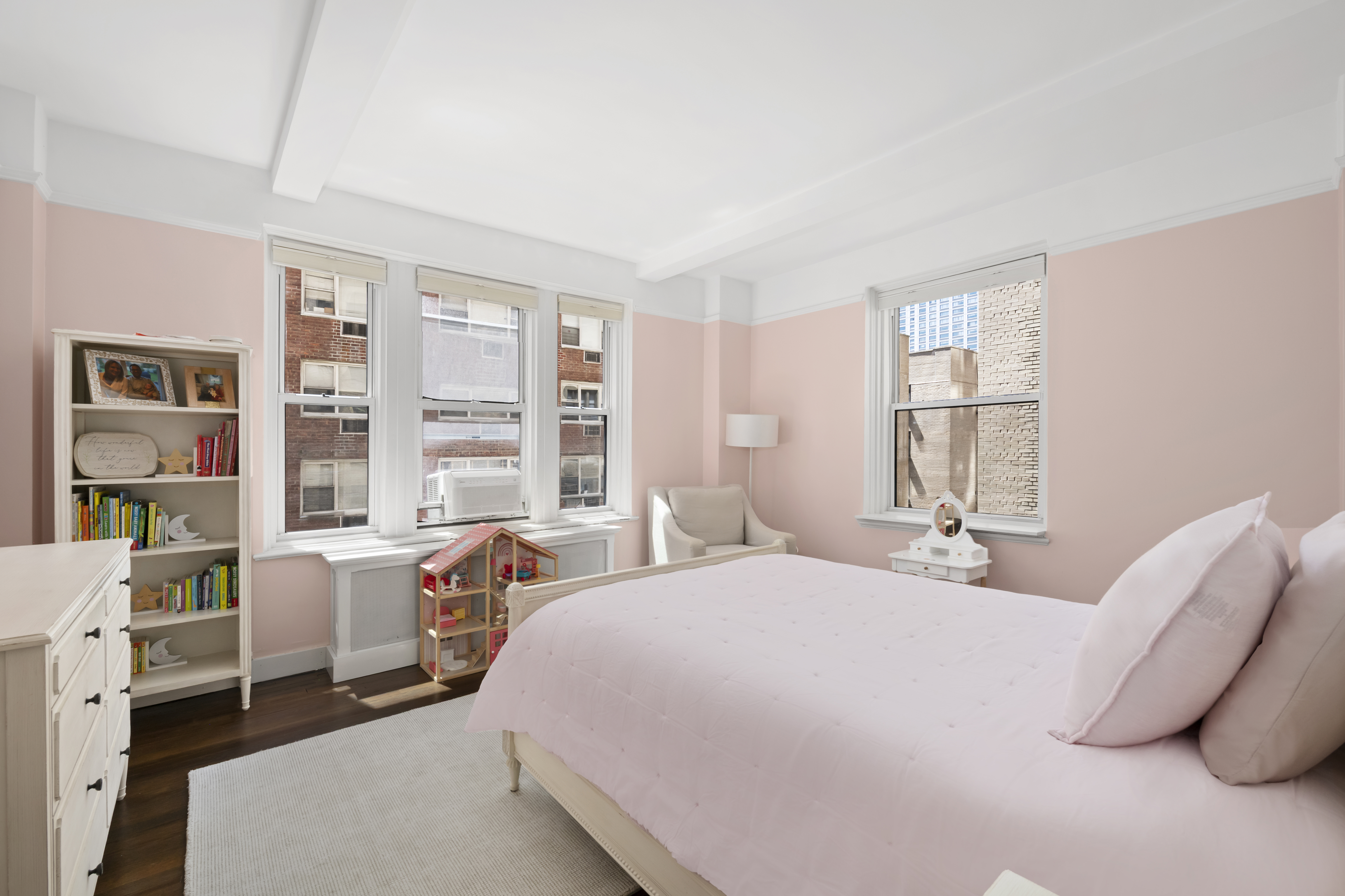 320 East 72nd Street, Unit 6A Manhattan, NY 10021 - Photo 6 of 13 a bedroom with a bed wooden floor and a large window