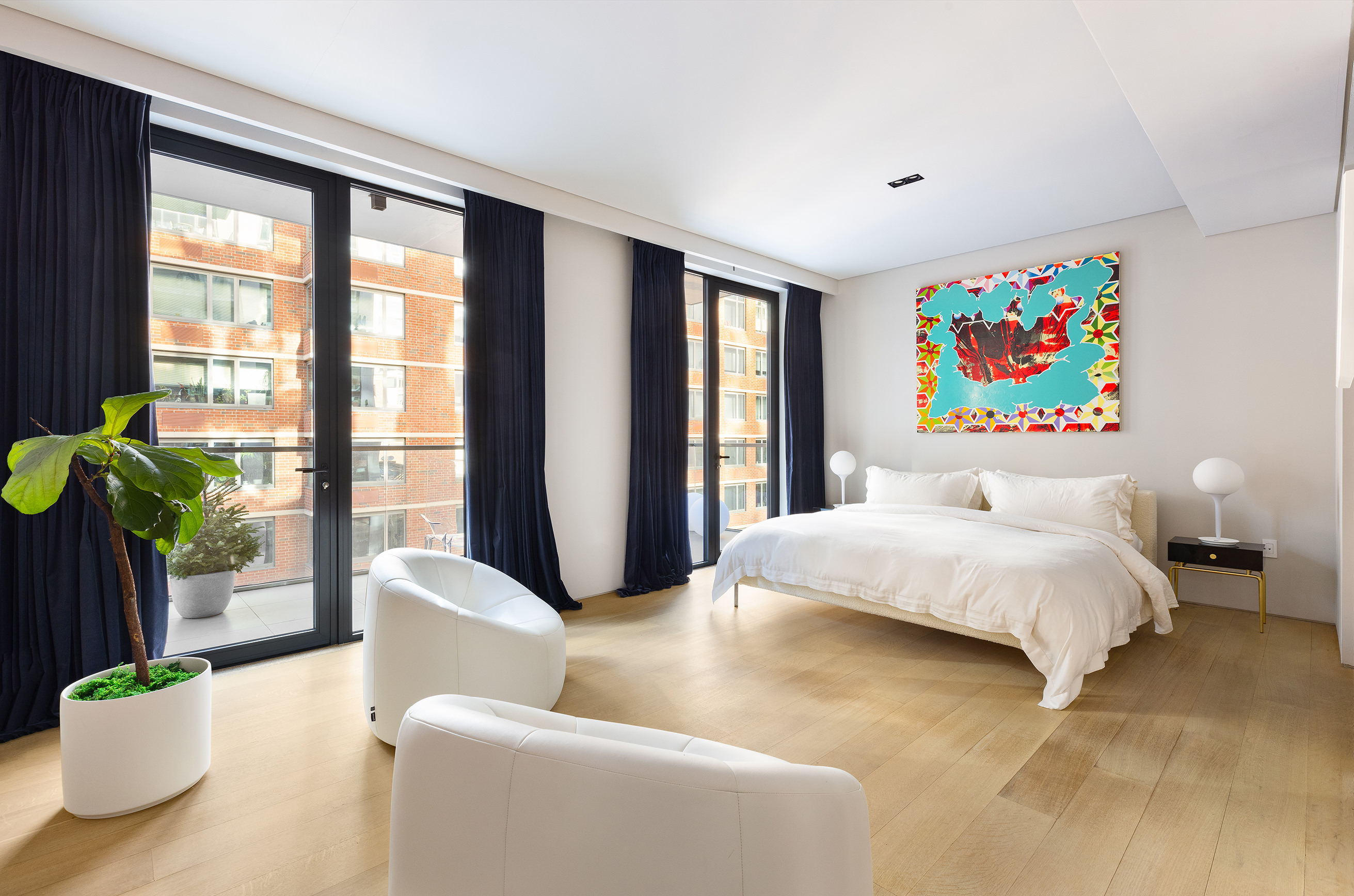 522 West 29th Street, Unit 5D Manhattan, NY 10001 - Photo 7 of 18 a bedroom with a bed and a large window