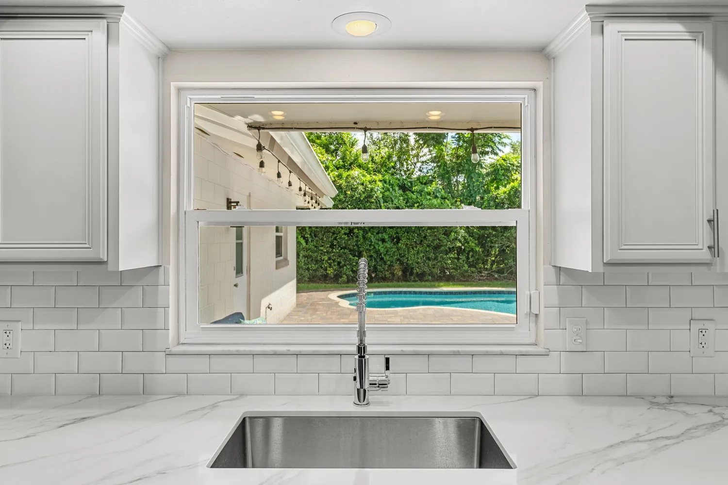 a dining room with furniture wooden floor a chandelier