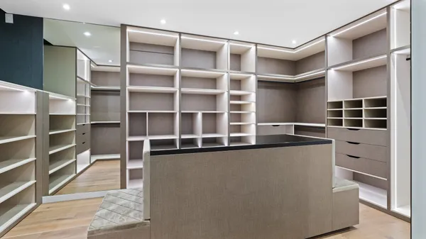 a view of an empty room with empty shelves