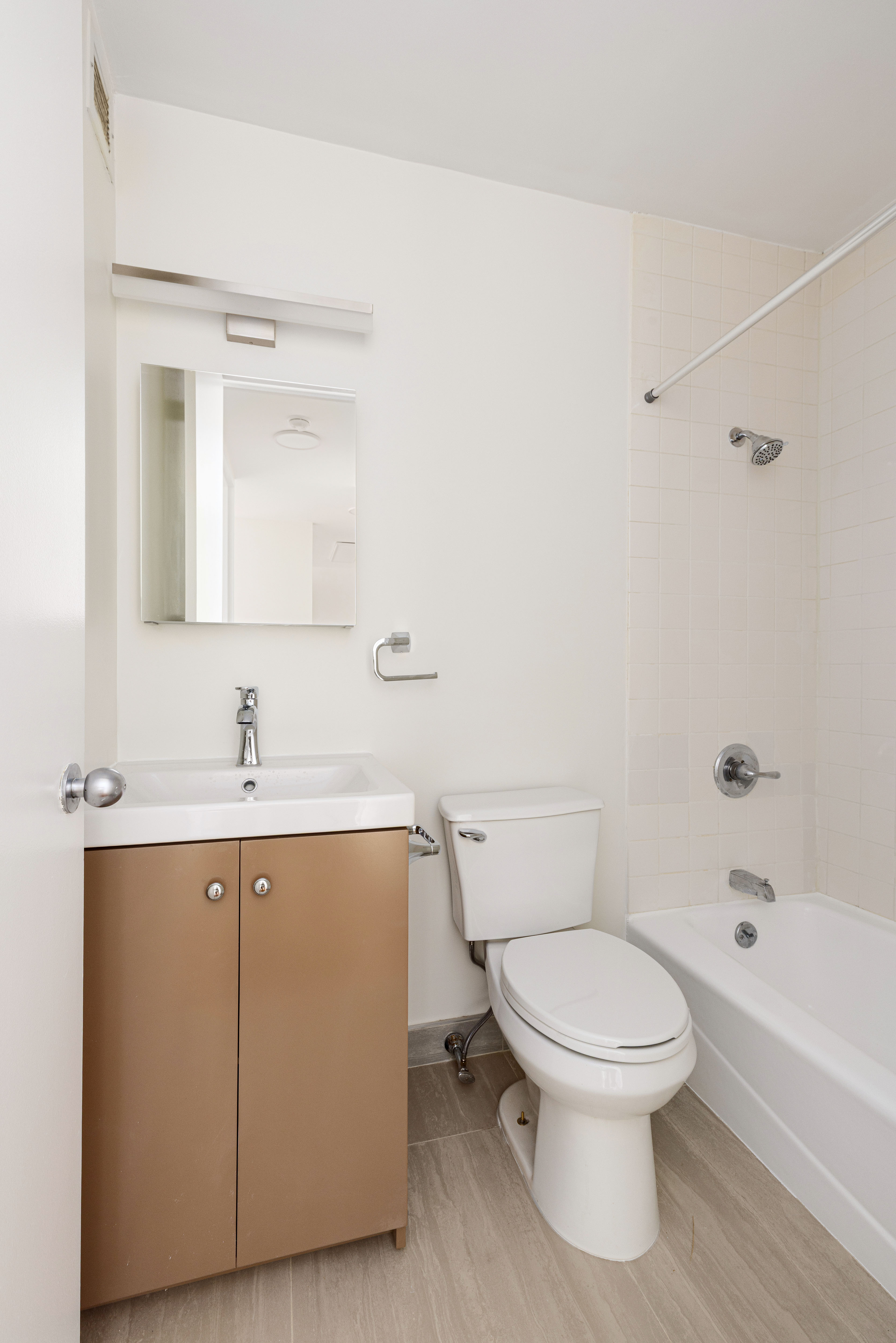 235 East 40th Street, Unit 4E Manhattan, NY 10016 - Photo 5 of 6 a white toilet sitting next to a bathroom sink