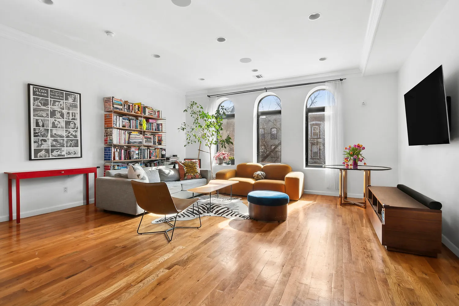 a living room with furniture and a flat screen tv
