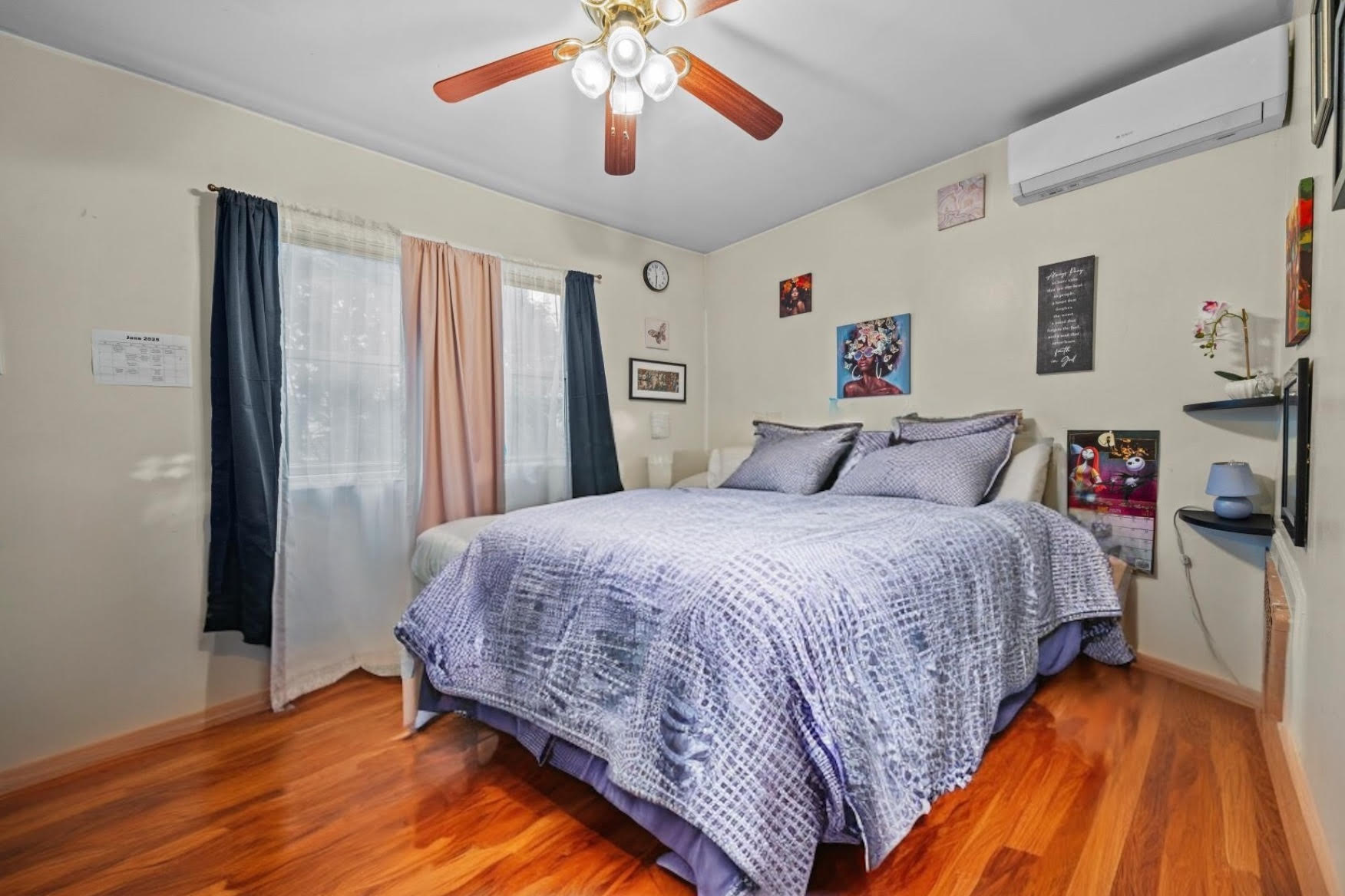 1419 East 54th Street Brooklyn, NY 11234 - Photo 9 of 19 a bedroom with a large bed and a chandelier