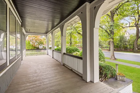 a spacious bedroom with a bed and a fireplace