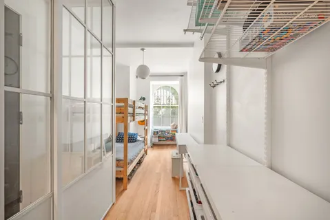 a view of a bathroom with a tub and windows