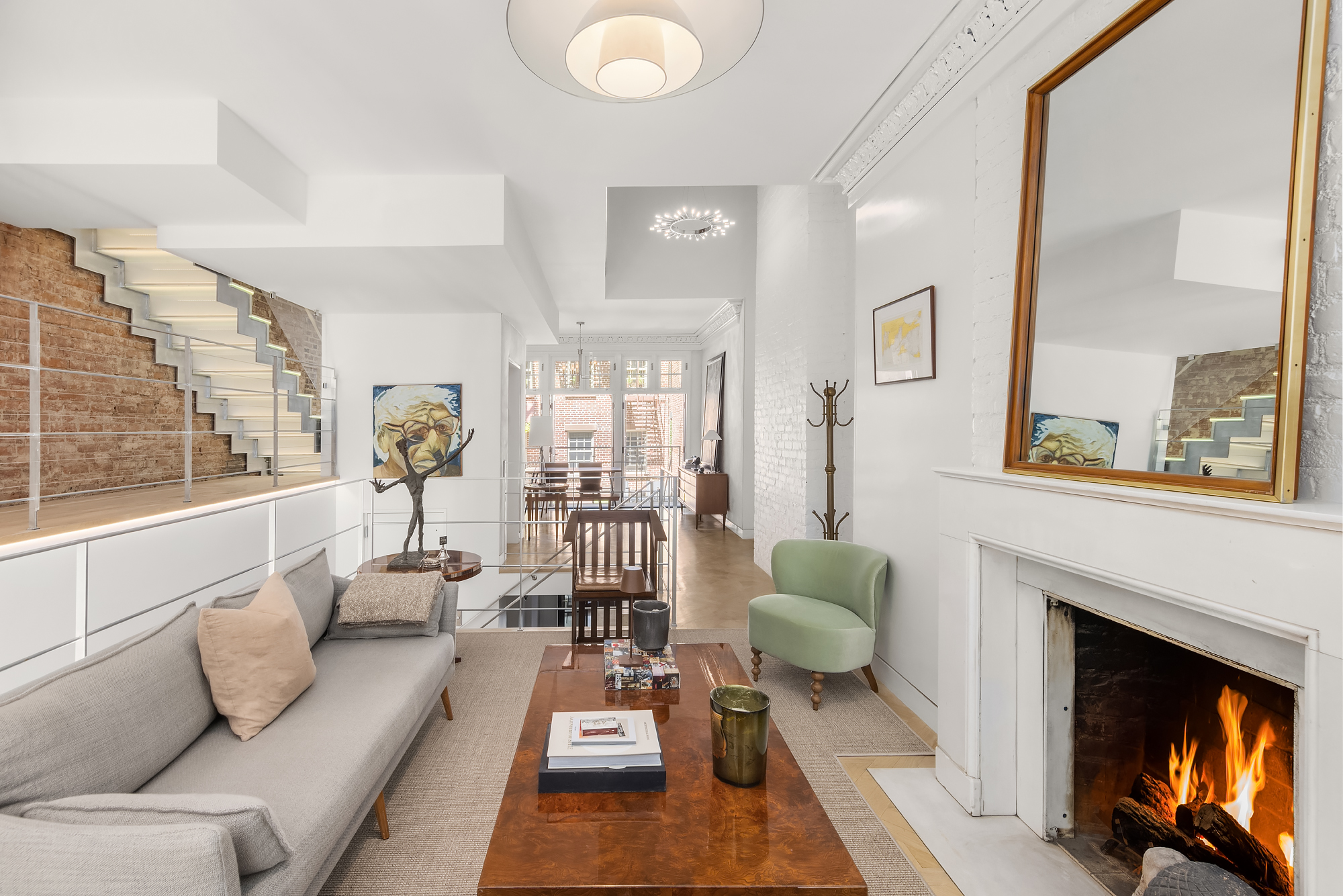 21 Cornelia Street Manhattan, NY 10014 - Photo 5 of 26 a living room with furniture and a fireplace