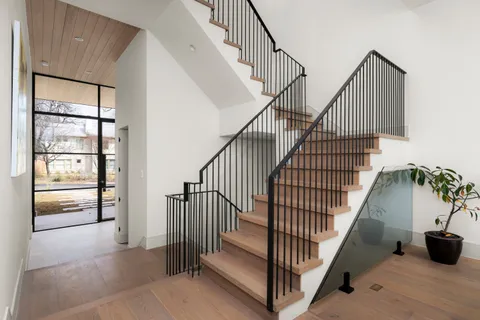a bathroom with a granite countertop bathtub shower and toilet