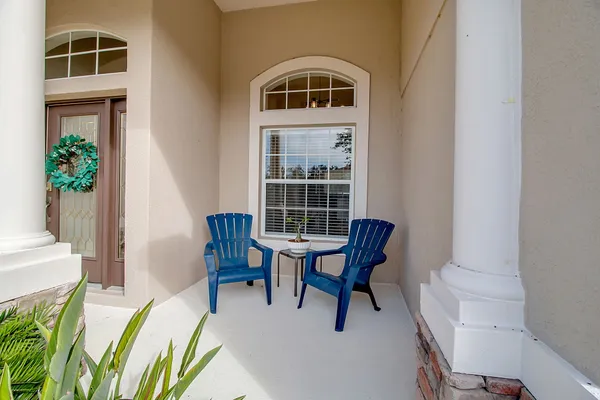 a living room with furniture and a lamp