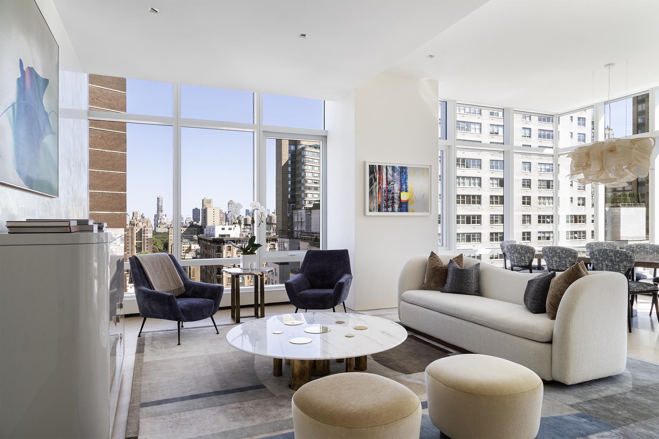 200 Amsterdam Avenue, Unit 17A Manhattan, NY 10023 - Photo 2 of 24 a living room with furniture and a large window