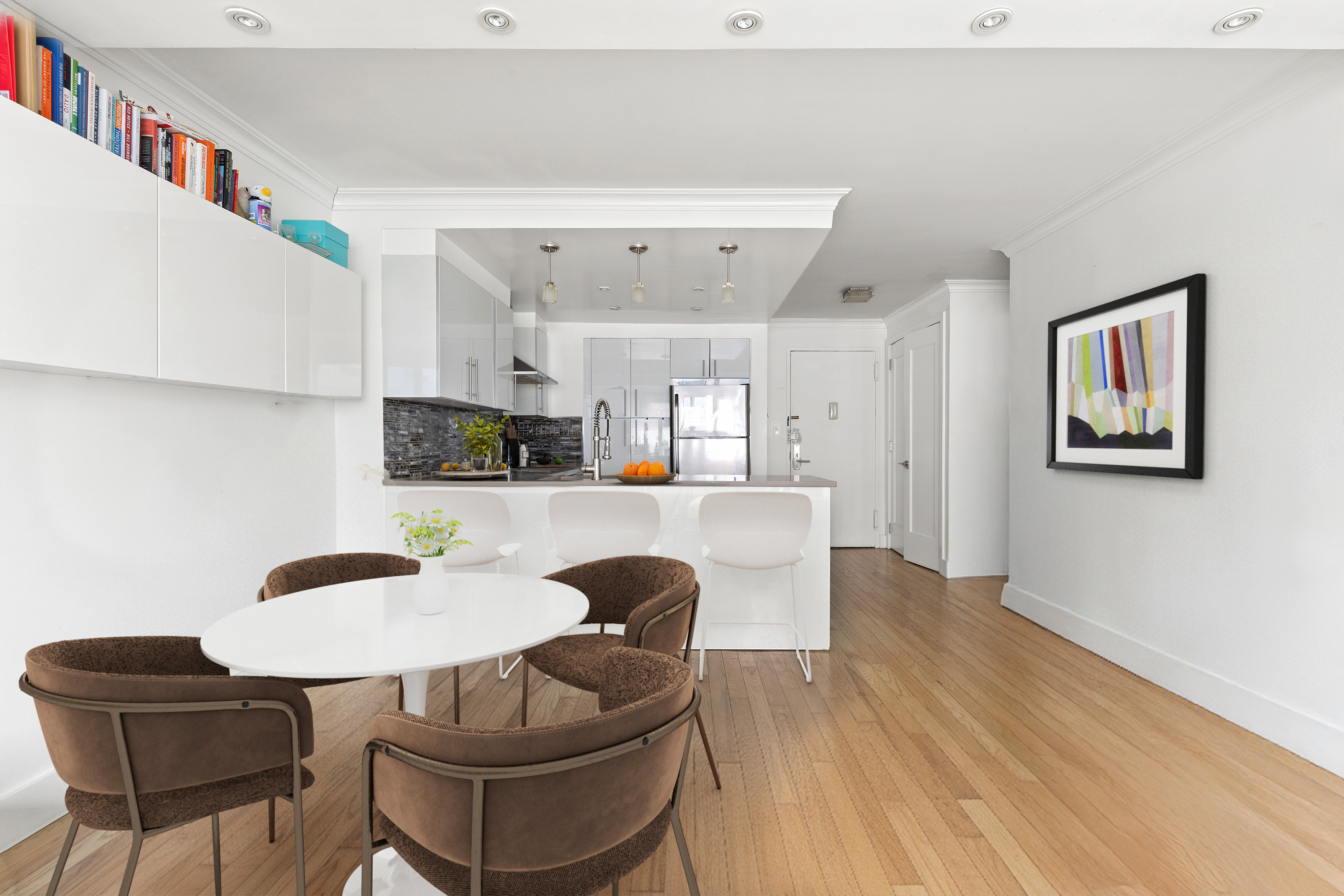 201 East 25th Street, Unit 7F Manhattan, NY 10010 - Photo 2 of 10 a living room with furniture and a wooden floor