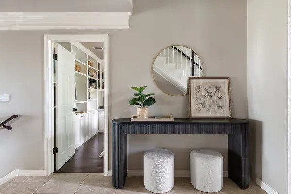 a front view of a house with wooden floor and cabinet