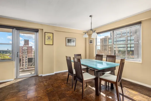 a view of a dining room with furniture window and outside view