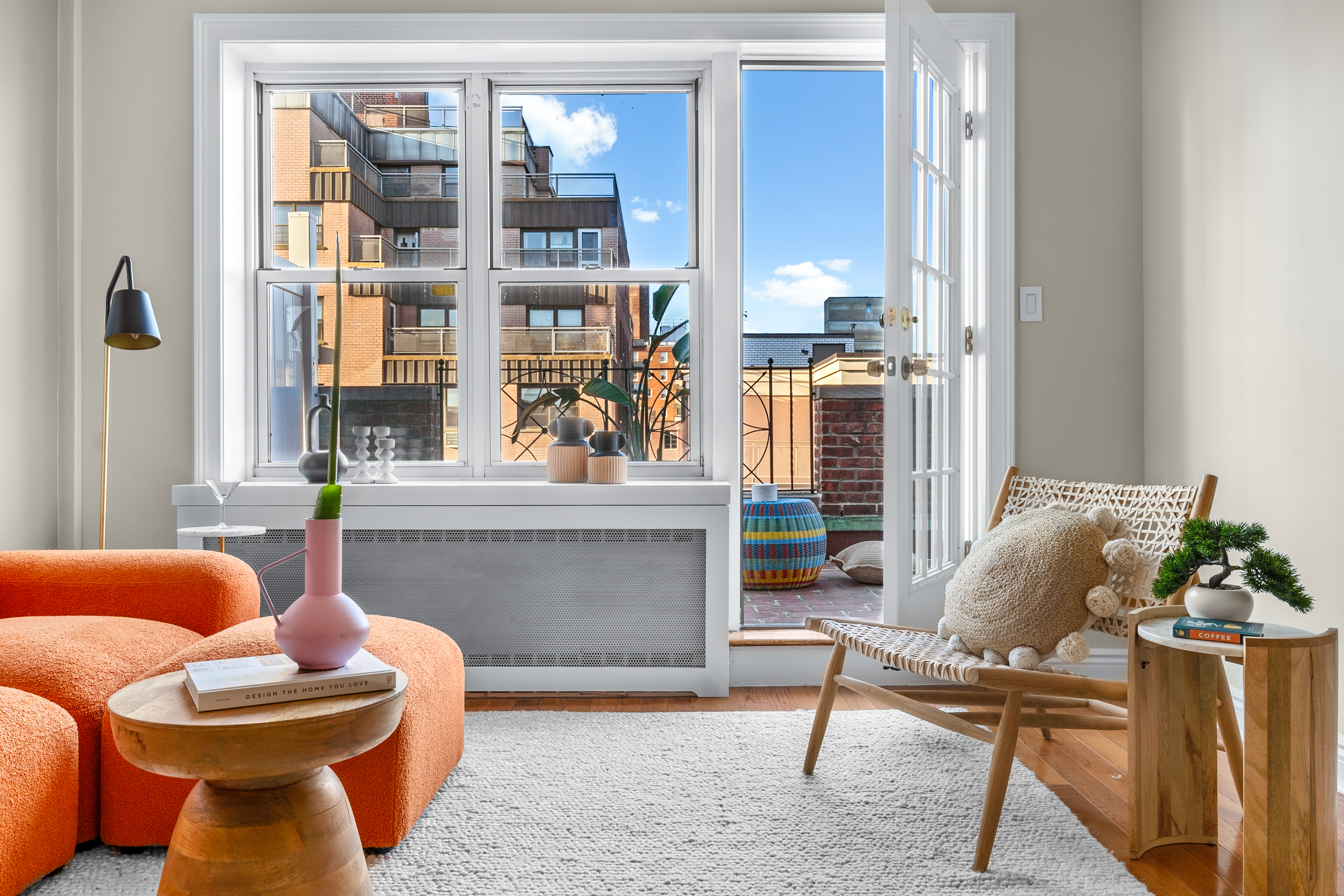 71-36 110th Street, Unit PH7E Queens, NY 11375 - Photo 3 of 16 a living room with furniture and a window
