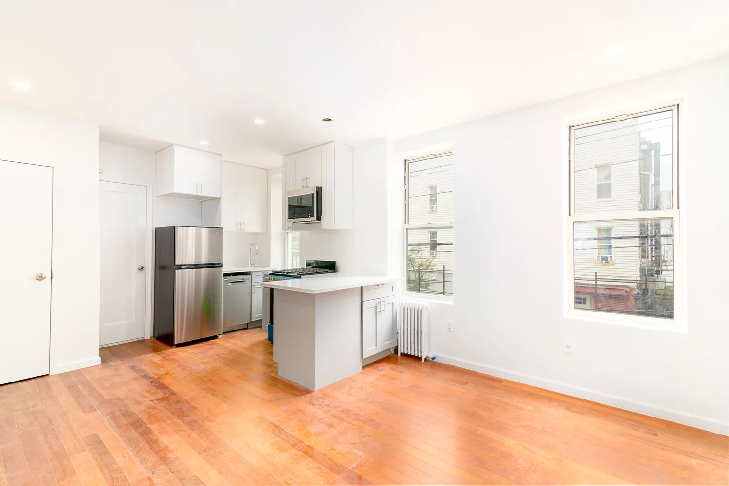 a kitchen with a refrigerator and window