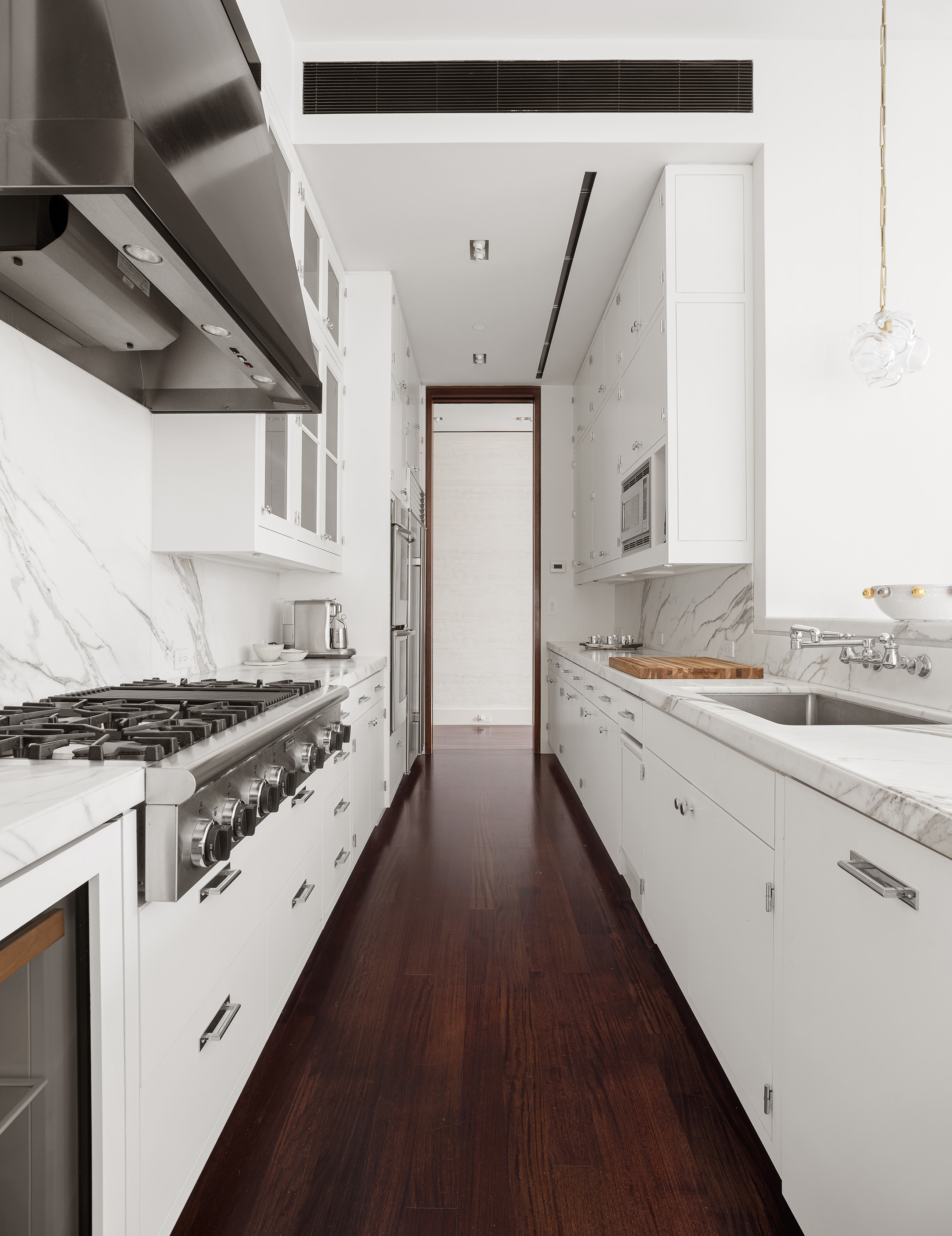 7 Hubert Street, Unit 8A Manhattan, NY 10013 - Photo 9 of 19 a kitchen with stainless steel appliances granite countertop a stove and a sink