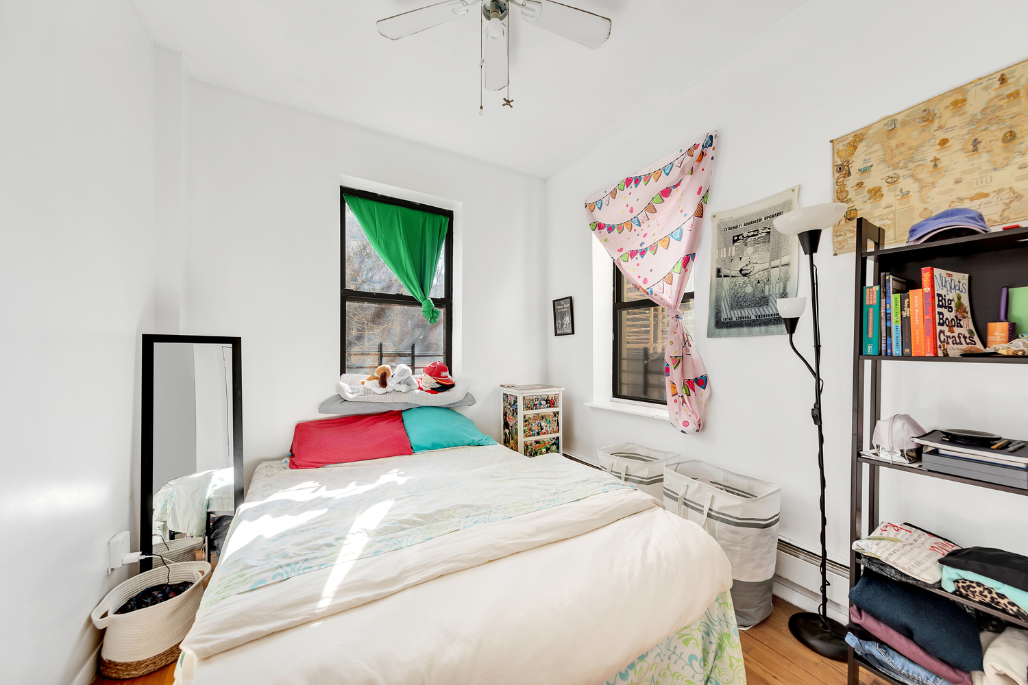 420 East 117th Street Manhattan, NY 10035 - Photo 6 of 11 a bedroom with a bed and a window