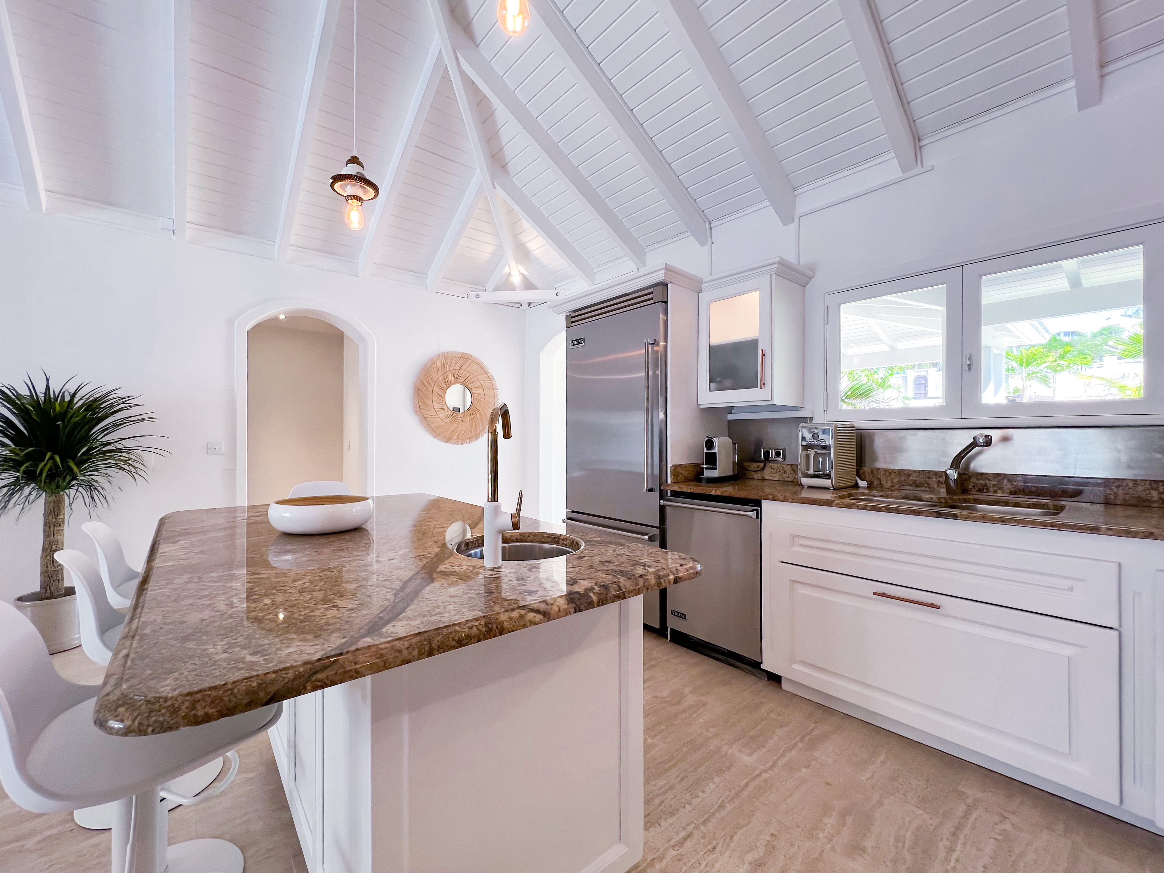Terres Basses St. Martin, undefined 97150 - Photo 8 of 32 a kitchen with granite countertop a stove a sink and a granite counter tops