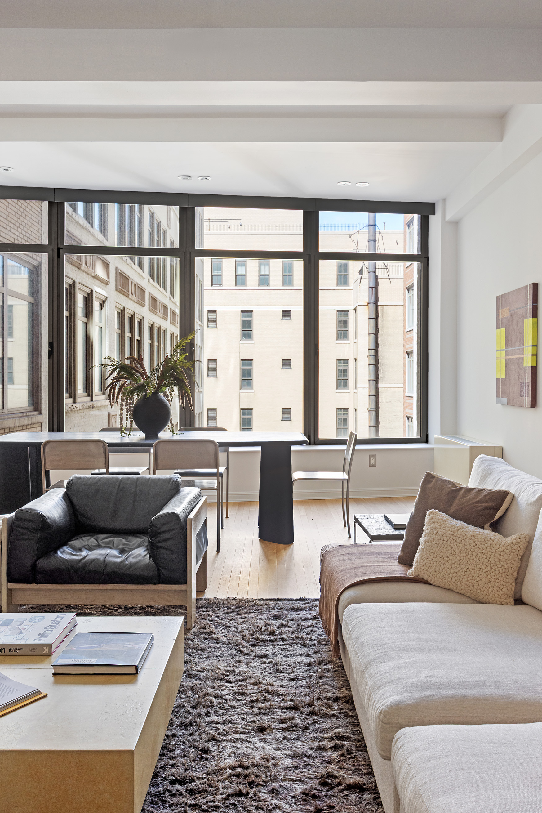 252 7th Avenue, Unit 9R Manhattan, NY 10001 - Photo 5 of 23 a living room with furniture and a large window