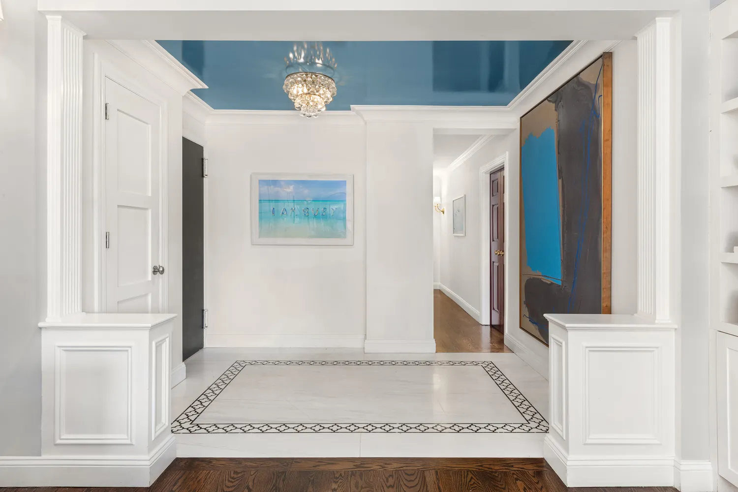 an entryway with wooden floor