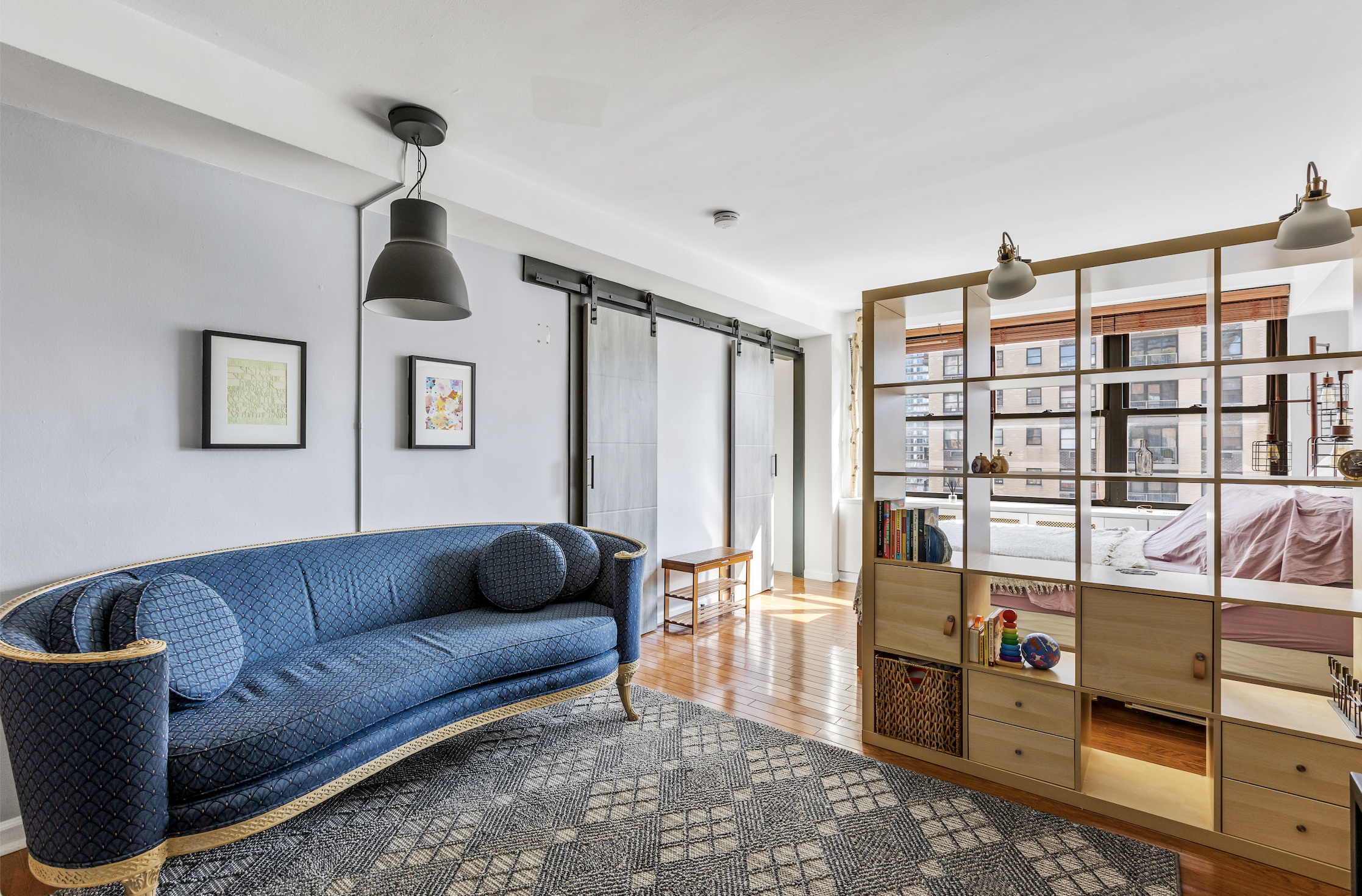 345 East 81st Street, Unit 19A Manhattan, NY 10028 - Photo 4 of 22 a living room with furniture and a flat screen tv