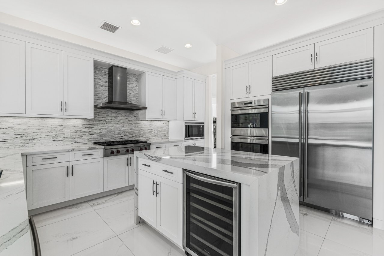 17352 Rosella Road Boca Raton, FL 33496 - Photo 8 of 41 a kitchen with cabinets stainless steel appliances and a counter space