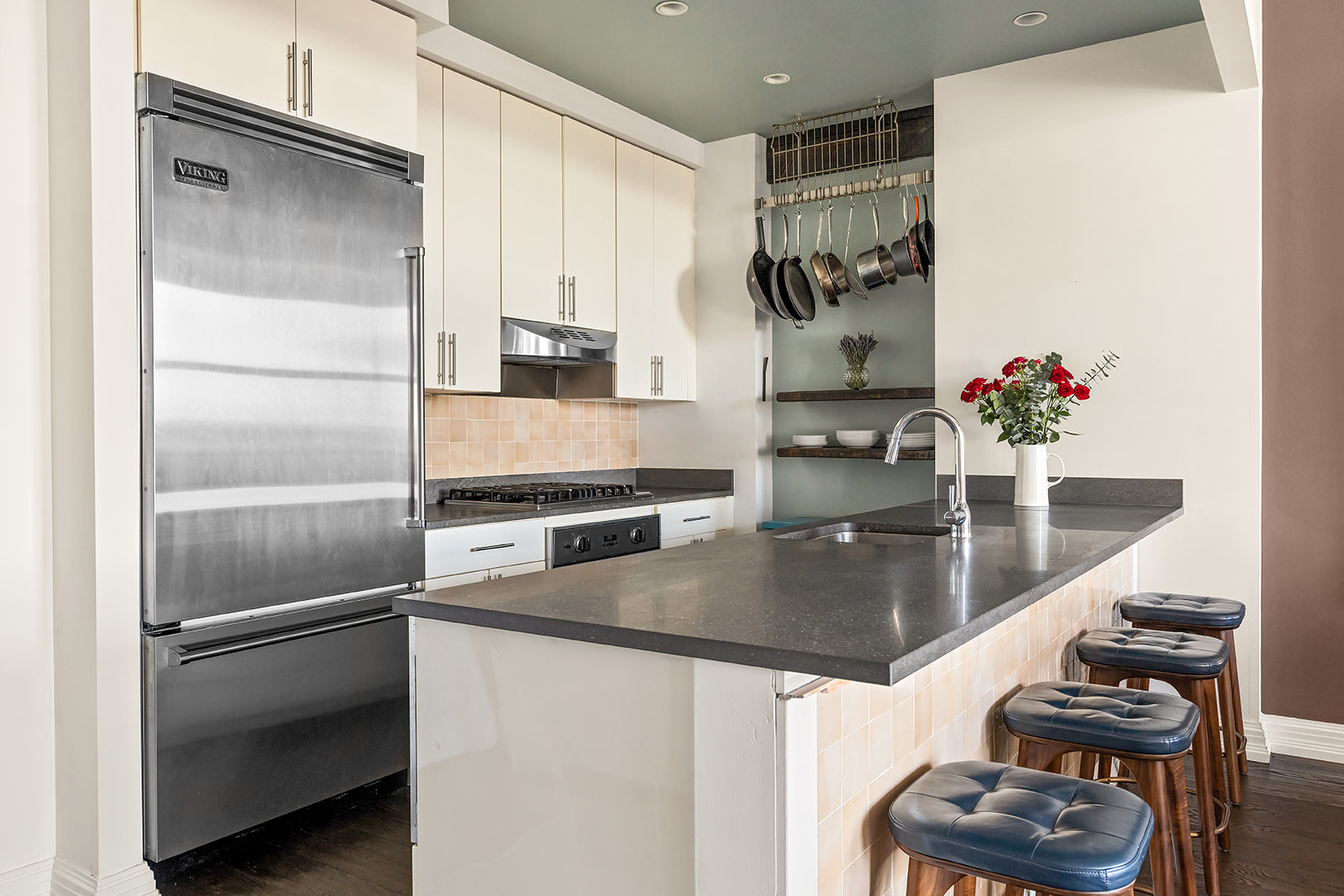 1 Hanson Place, Unit 11J Brooklyn, NY 11243 - Photo 3 of 10 a kitchen with stainless steel appliances granite countertop a refrigerator and a sink