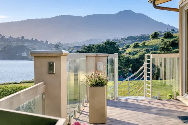 an aerial view of a house with swimming pool and mountain view