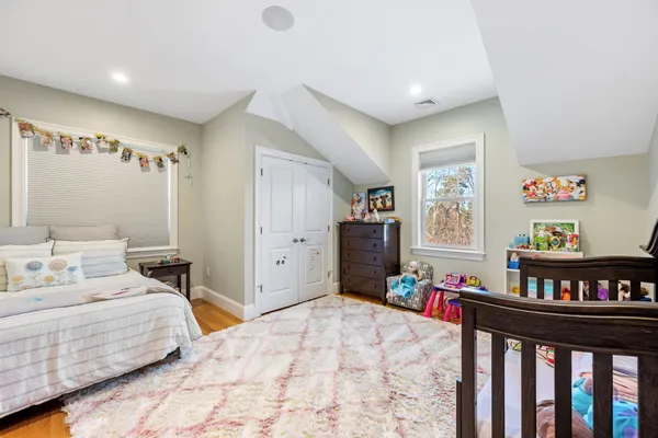 a bedroom with a bed and a cabinets