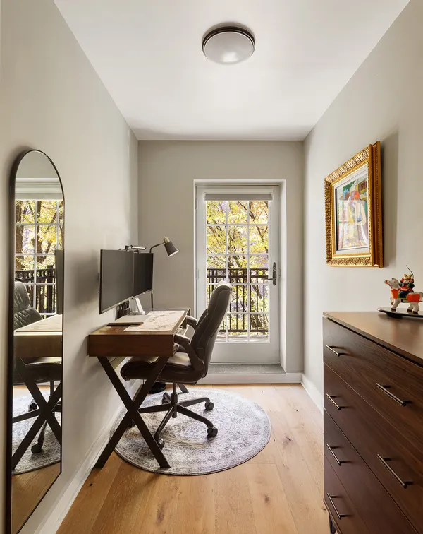 a workspace with furniture and a window