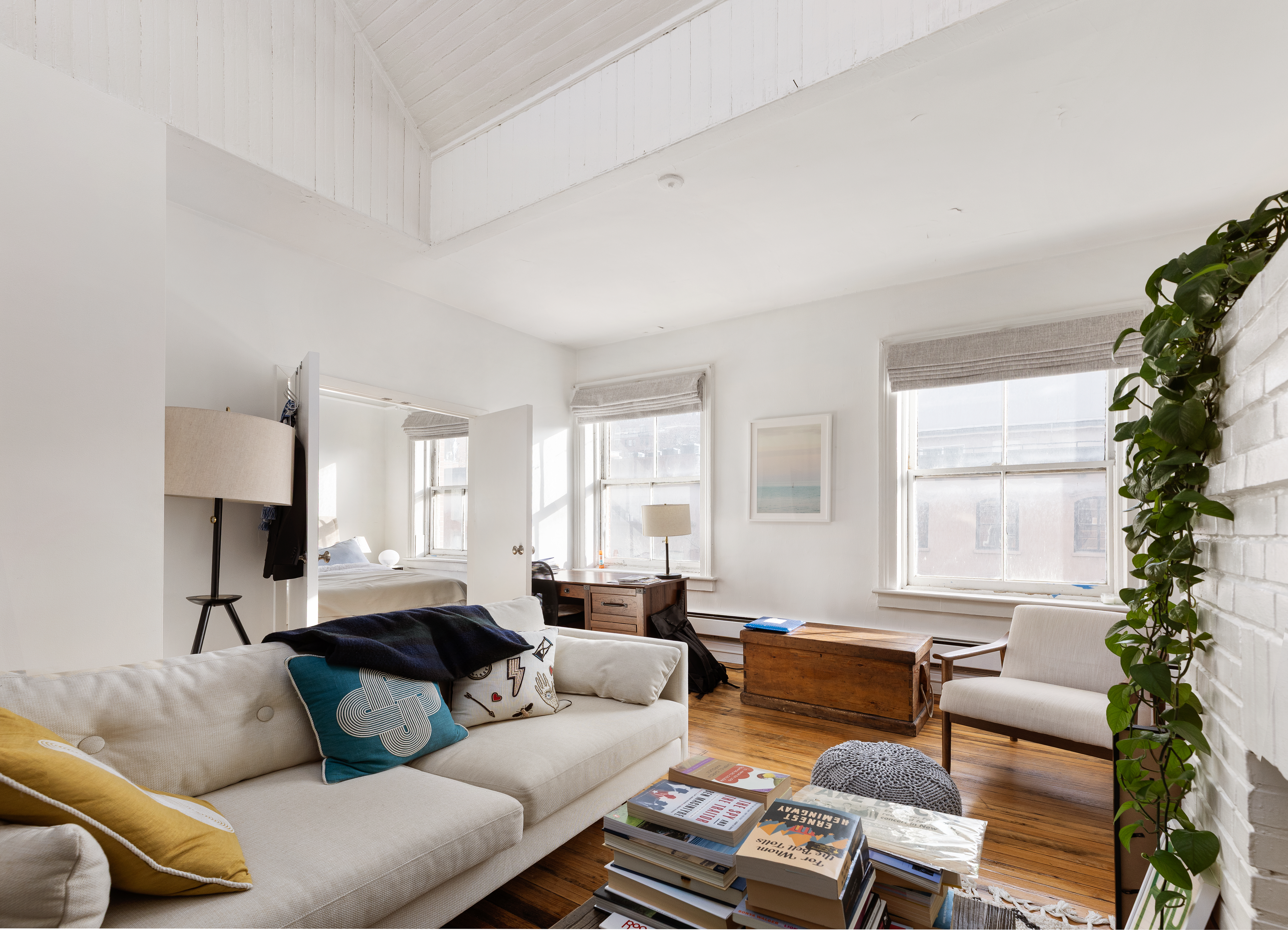 23 West 12th Street, Unit 4/5 Manhattan, NY 10011 - Photo 3 of 8 a living room with furniture and a large window