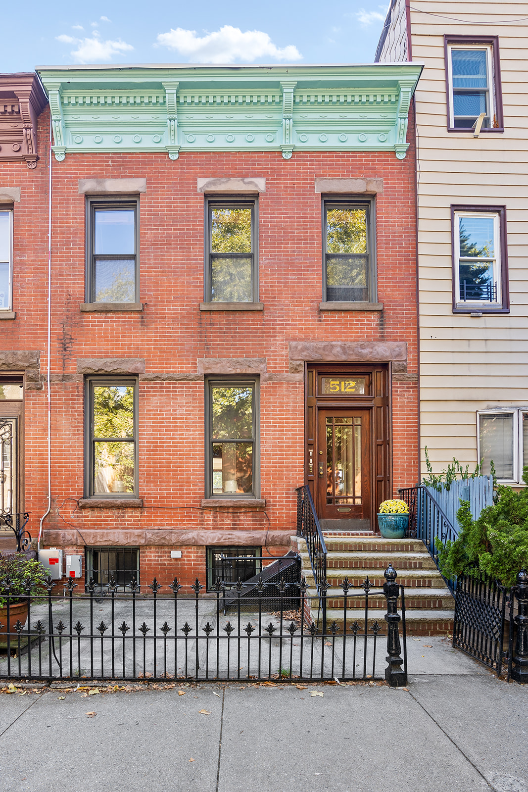 512 17th Street Brooklyn, NY 11215 - Photo 13 of 14 a front view of a building with glass windows