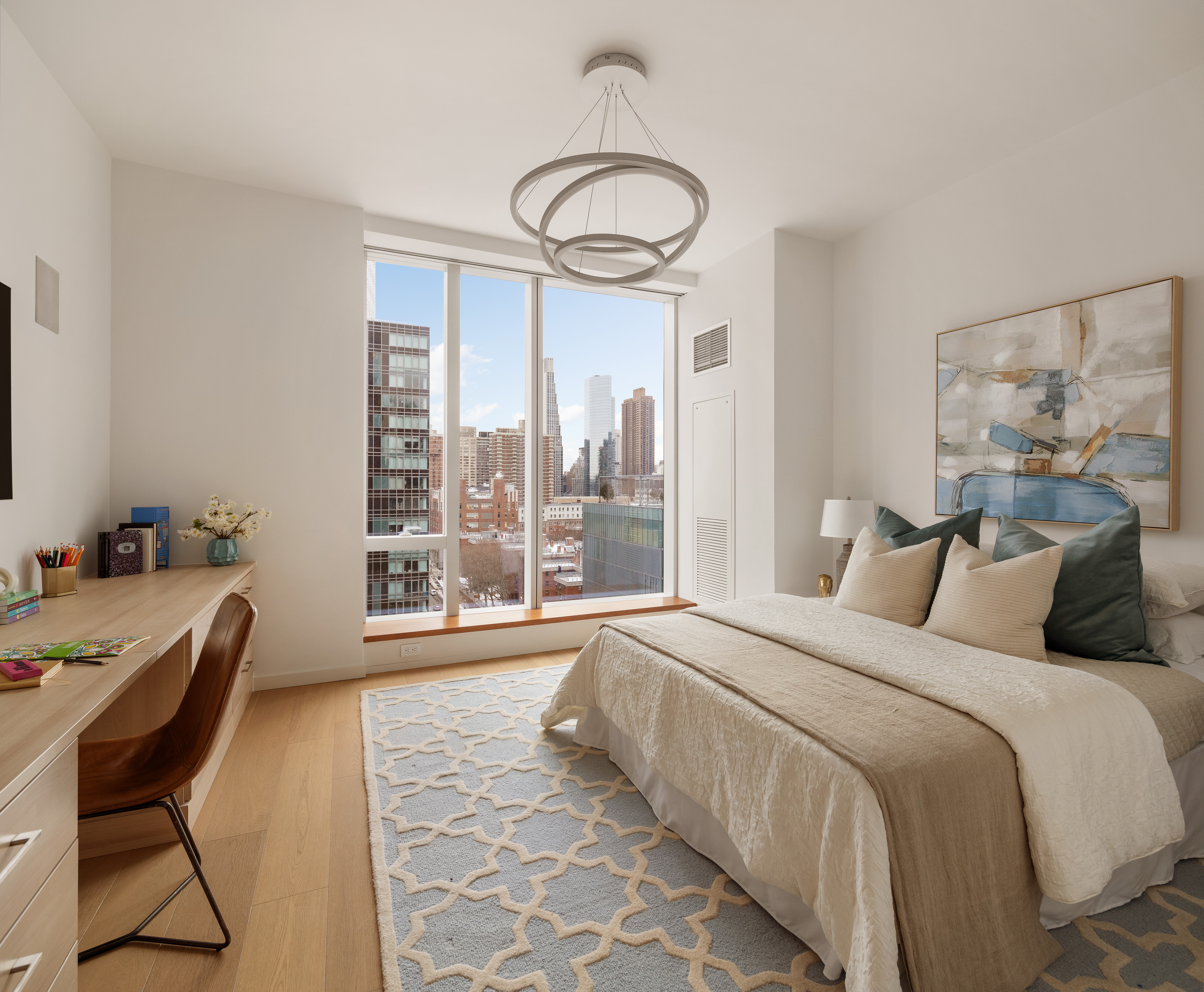 1 West End Avenue, Unit 12D Manhattan, NY 10023 - Photo 9 of 32 a bedroom with a bed and a large window