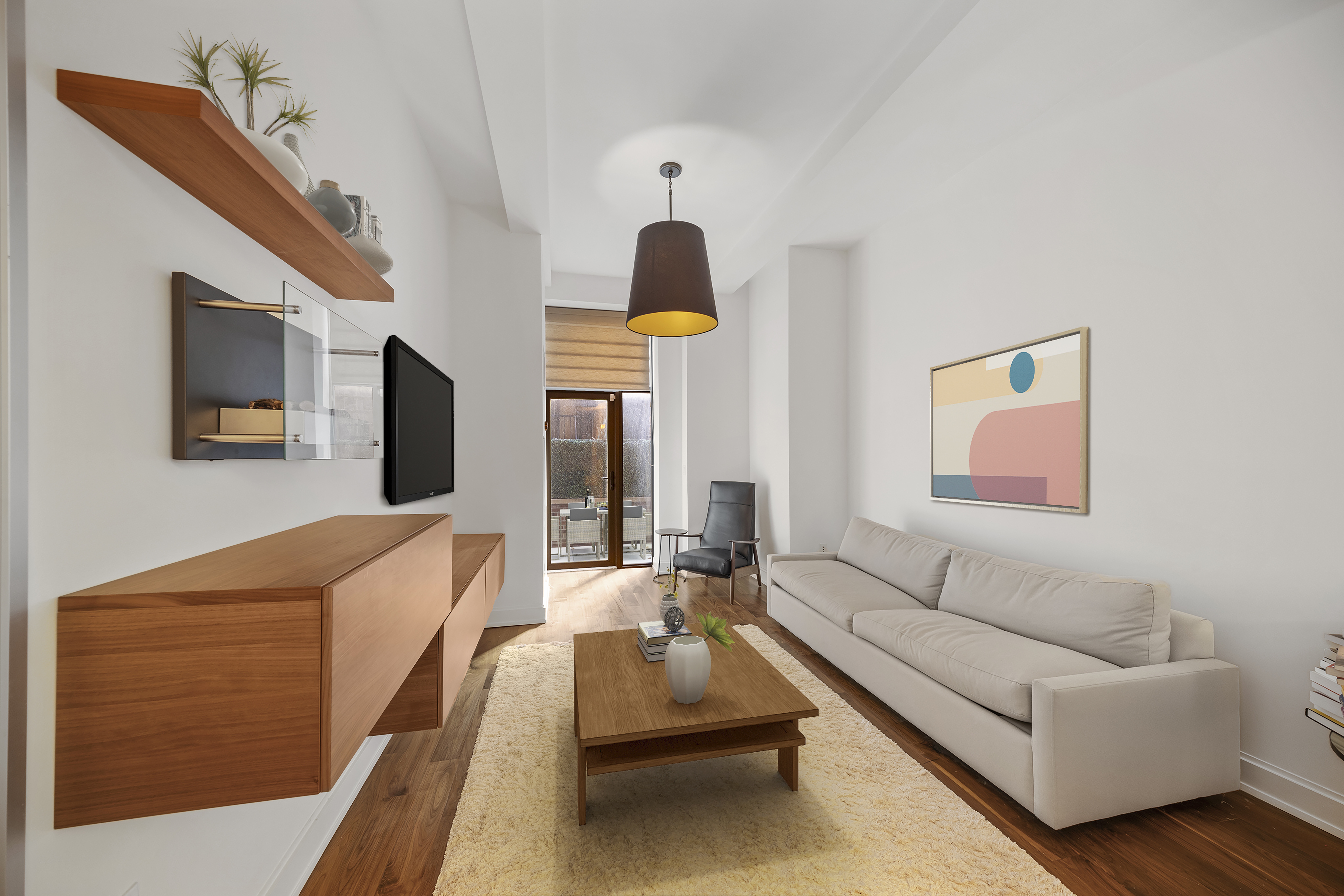 140 West 22nd Street, Unit 2D Manhattan, NY 10011 - Photo 3 of 10 a living room with furniture and a flat screen tv